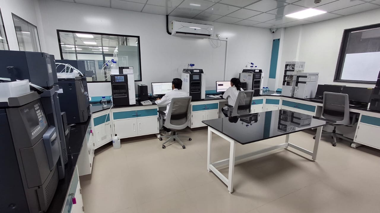 Analytical Chemists Operating Computerized Chromatography and Spectrometry Systems